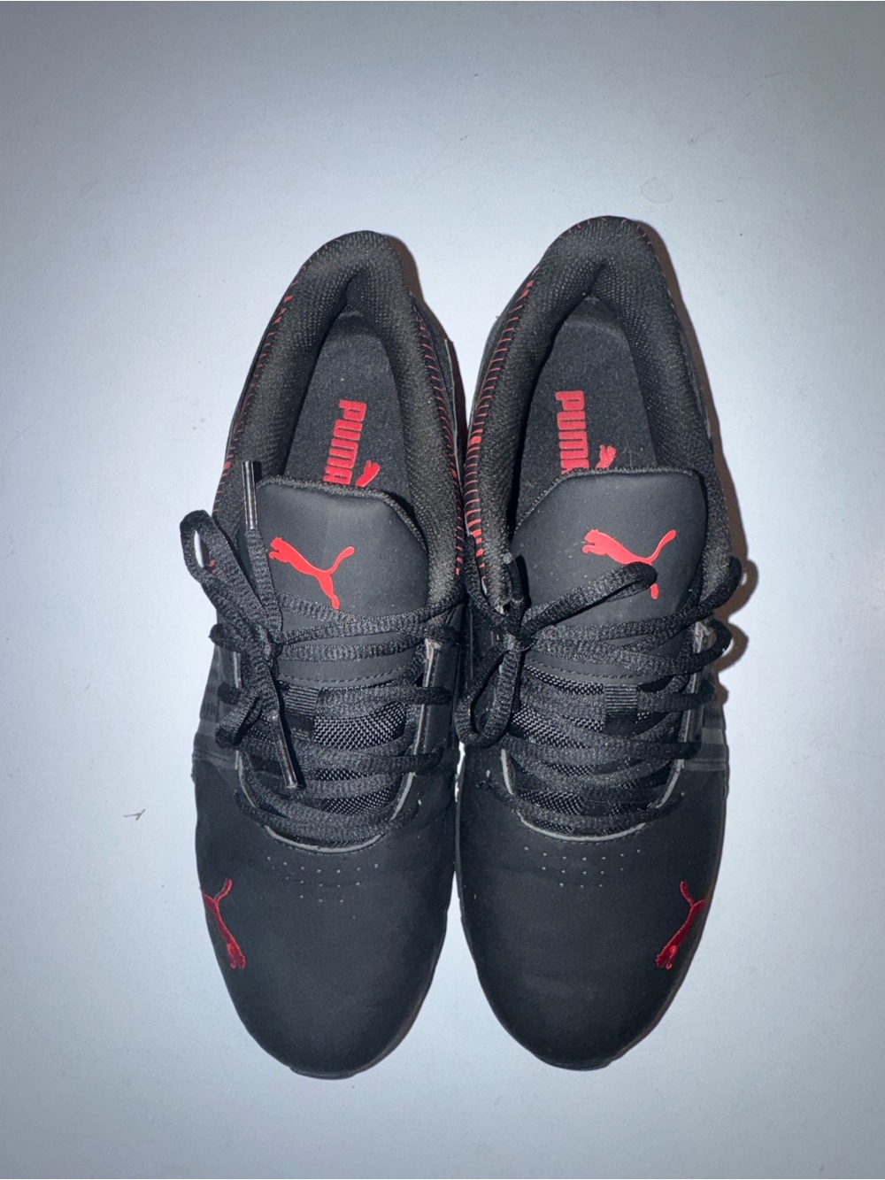 Puma Black Sneakers with Red Logo Accents